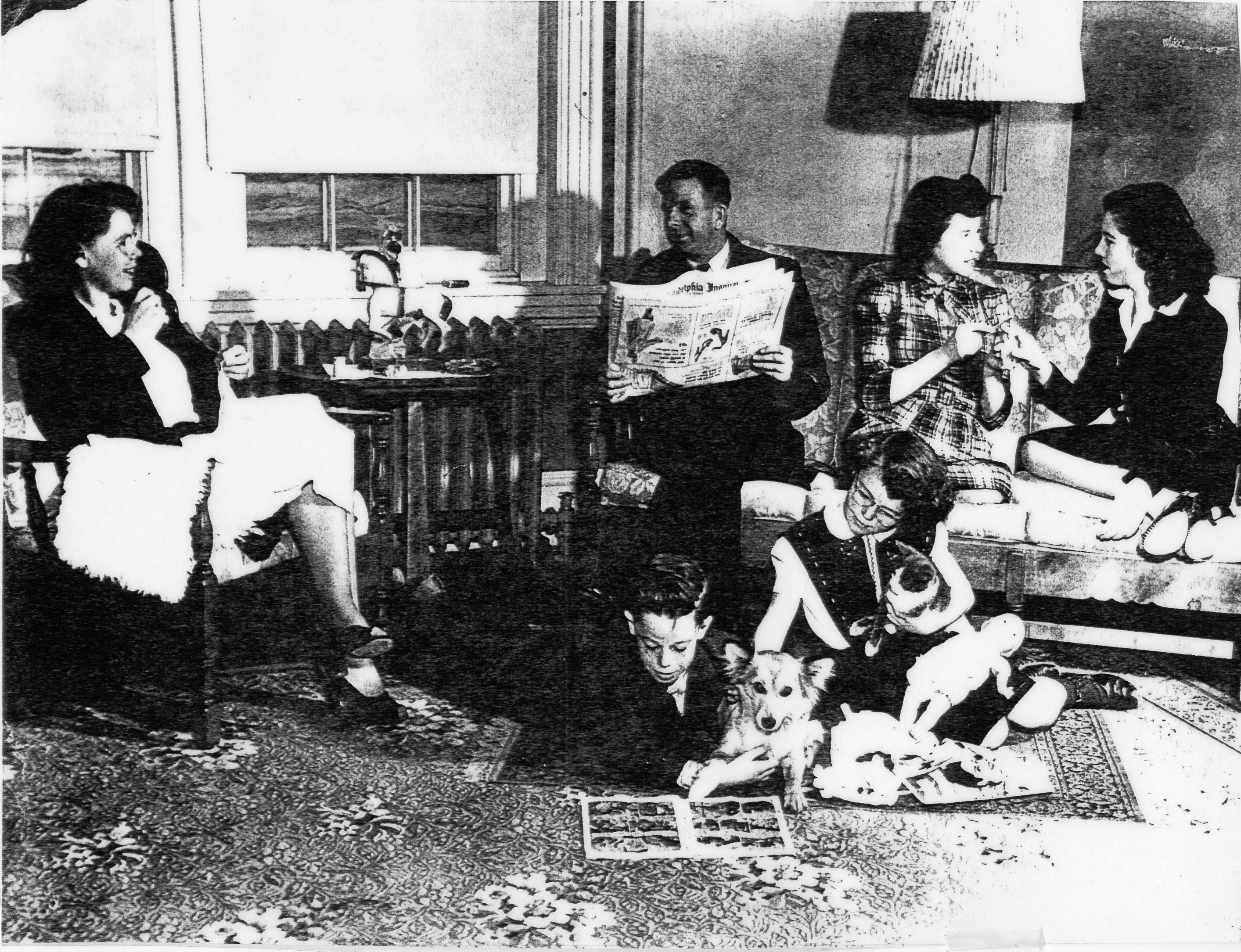 The Baker Family in the front parlor of the Hereford Lighthouse- 1946   Young Jack and sister, Winnie on floor with their dog “Bunny”